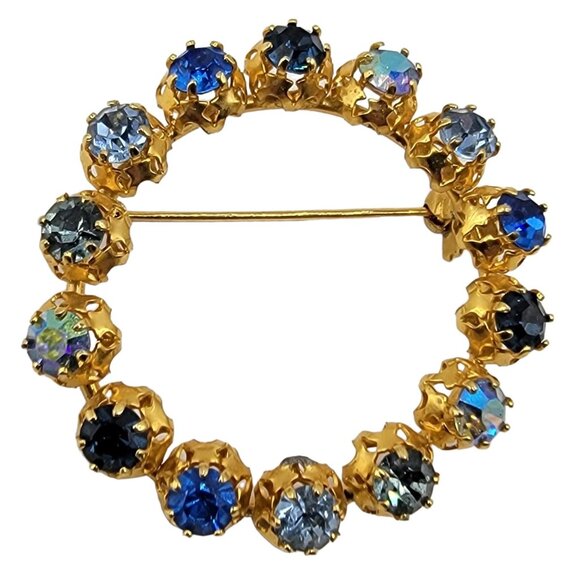 Austria Jewelry - Austria Gold Tone Blue Rhinestone Open Round Filigree Brooch Pin